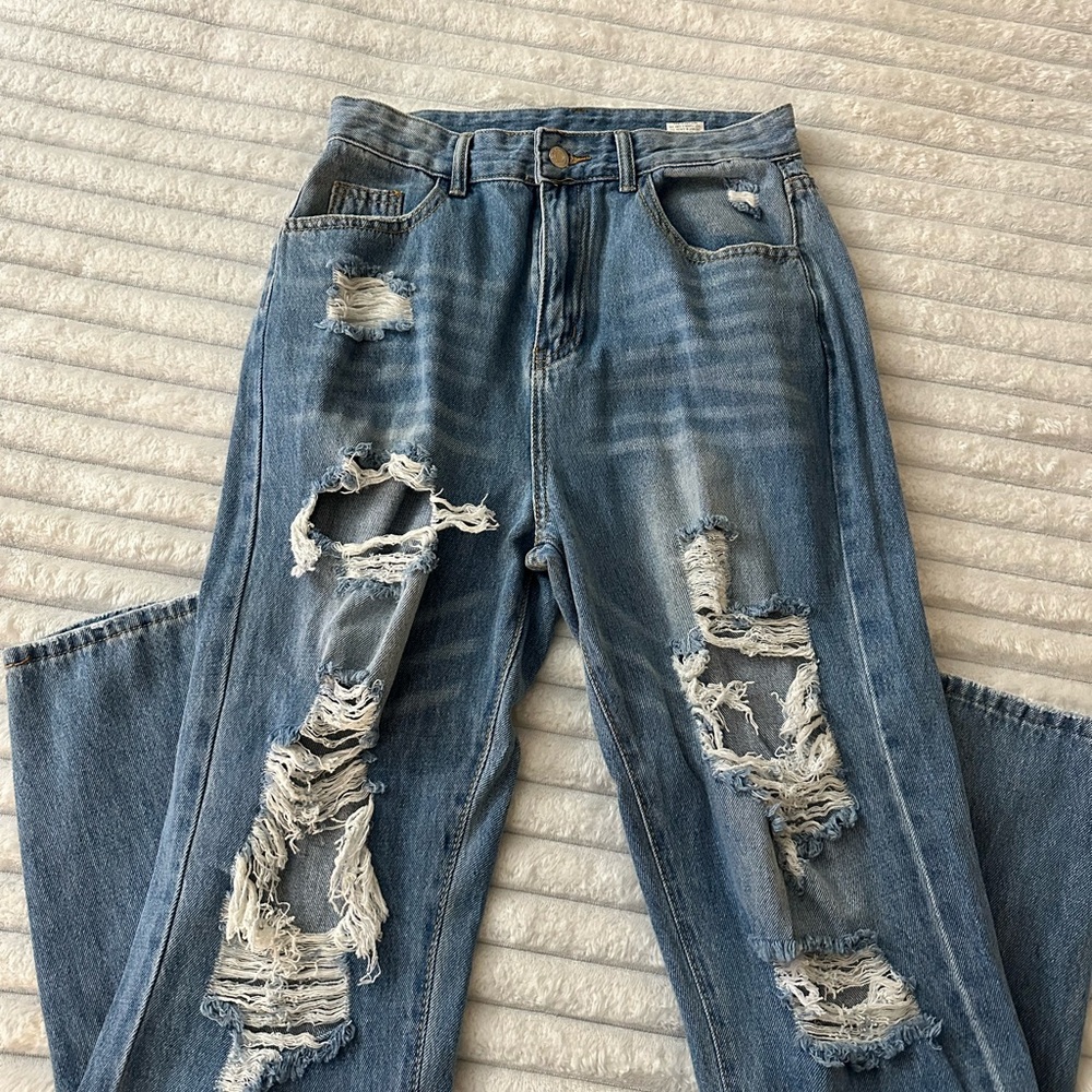 Distressed Blue Denim Jeans